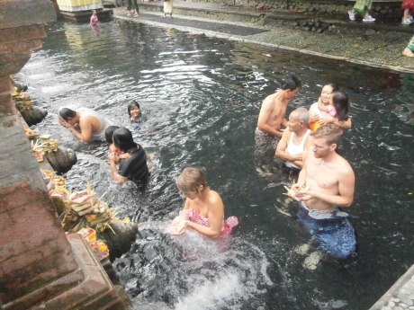 Locals and some converts  are making their pilgrimage in Tirta Empul, the source of holy water that flows out to the waterways and irrigation systems in Tampak Siring area. 